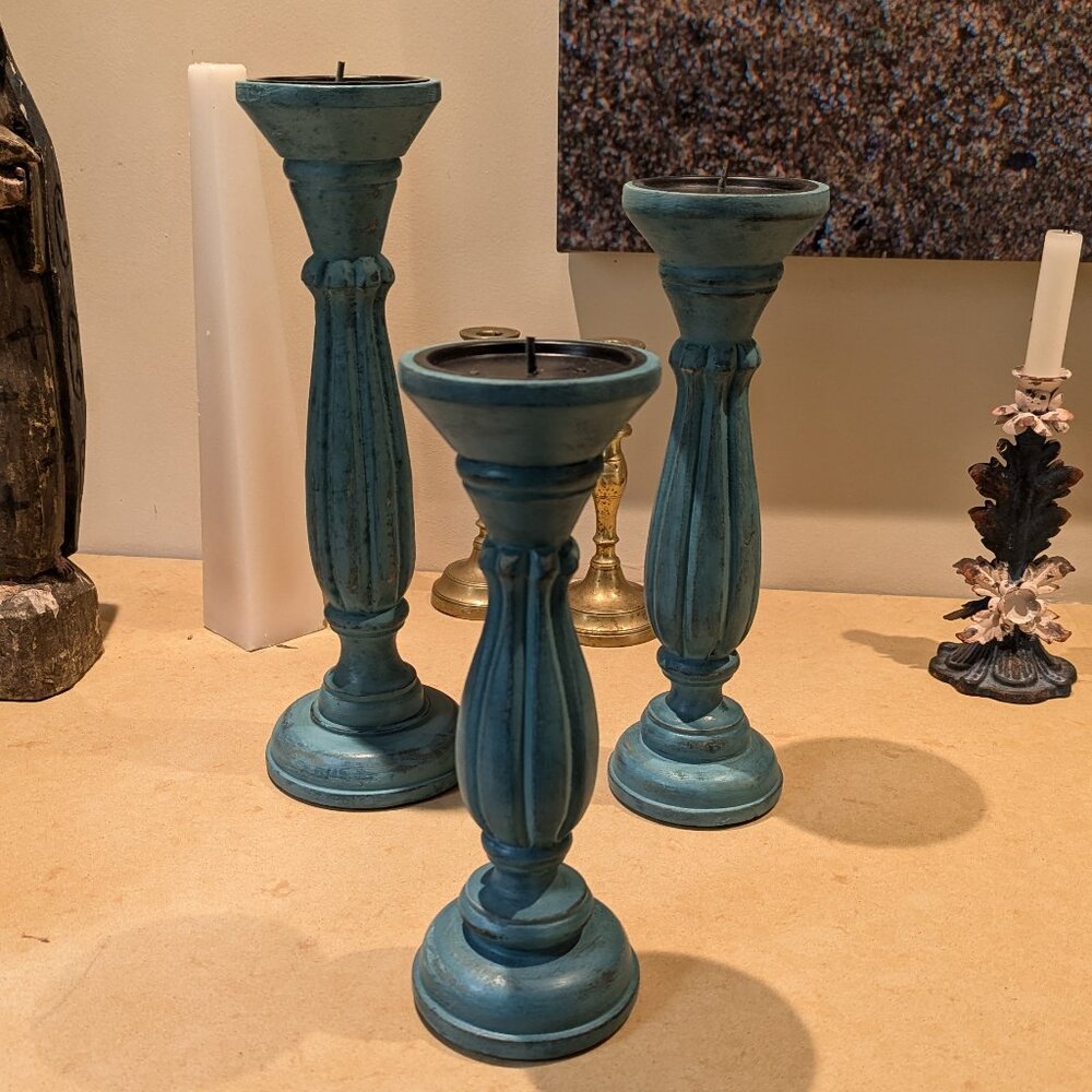 A Set of Turquoise Blue Wooden Candle Holders